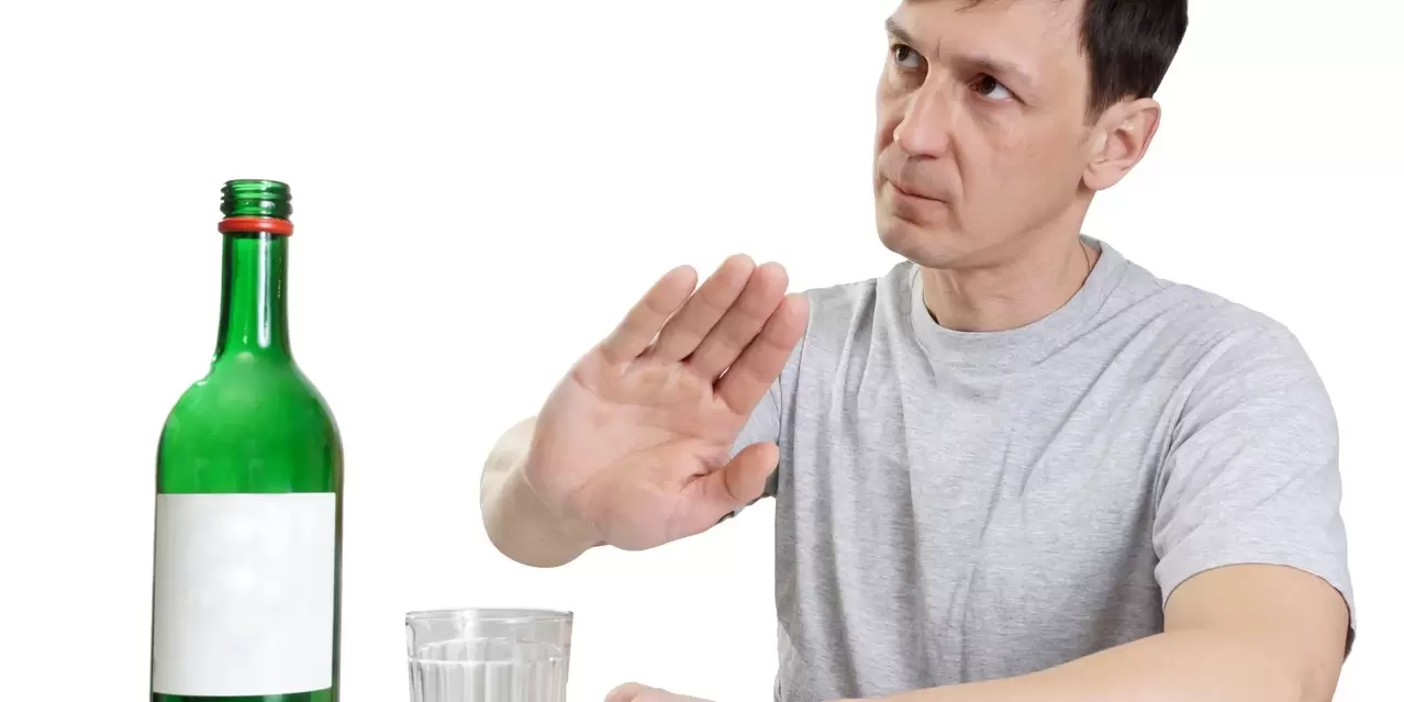 A man refuses alcohol